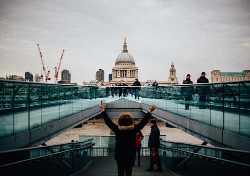human woman standing and raising her hands person