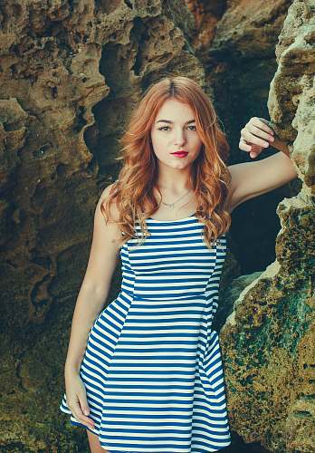 person woman standing beside rock formations human