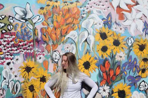 human woman standing in front of graffiti person