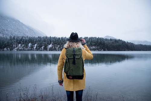 person woman standing near body of water human