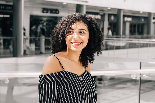 human woman wearing black and white stripe top person