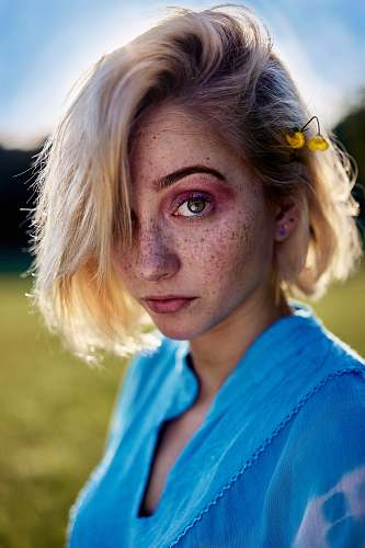 human woman wearing blue scoop-neck top person