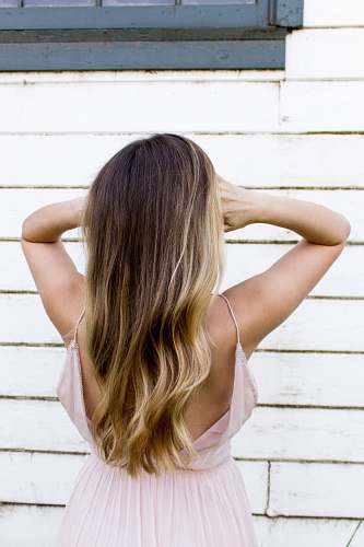 person woman wearing pink spaghetti strap dress hair