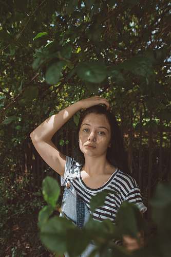 human woman wearing white and black striped top person