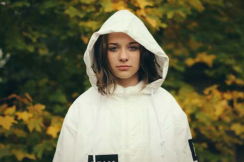 human woman wearing white zip-up hoodie jacket person