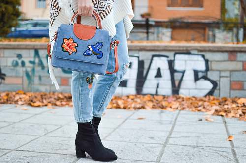 human women's black booties person
