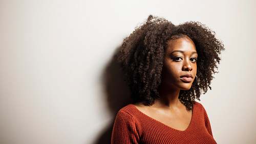hair women's red scoop-neck shirt afro hairstyle