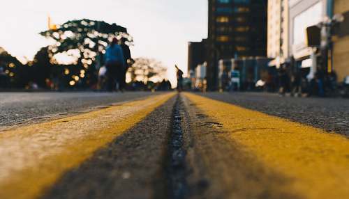 person yellow and black road at daytime human