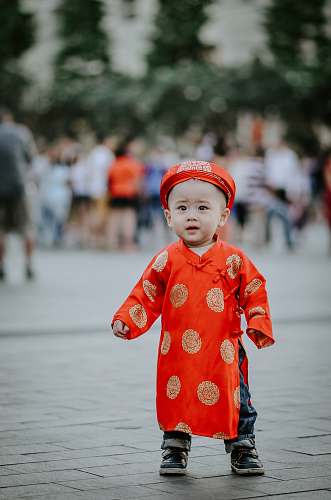 people baby's orange dress human
