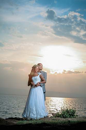 people couple's pre-nuptial photo near sea human