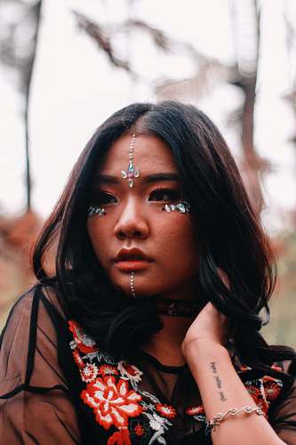 people depth of field photography of woman with face accessories human