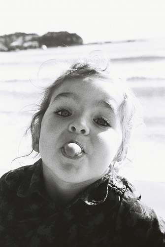 human grayscale photography of girl black-and-white