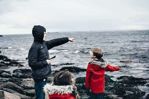 people man and boy in seashore at daytime human