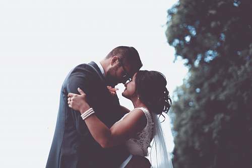 human man and woman holding and looking each other people