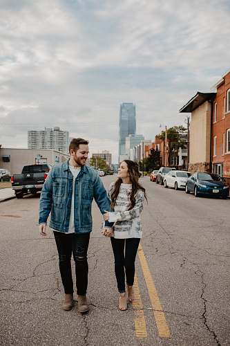 human man and woman standing on road people