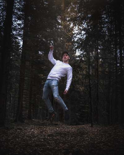 human man between trees people