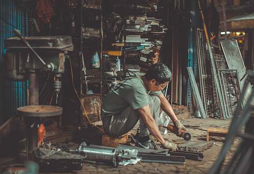 people man holding angle grinder human