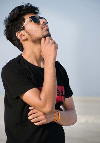 people man in black Levi's t-shirt looking up human