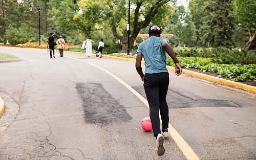 people man running behind red ball human