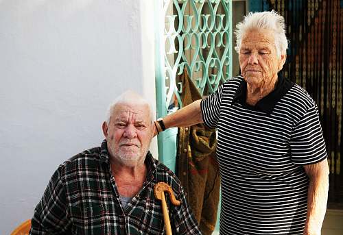people man sitting on the chair beside his wife human