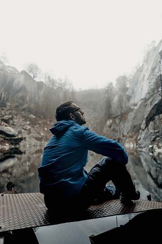 people man sitting while looking up human