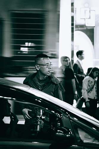 people man smoking near car human
