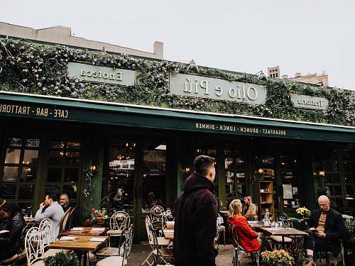 people man standing at Olio e Piu store front during daytime human