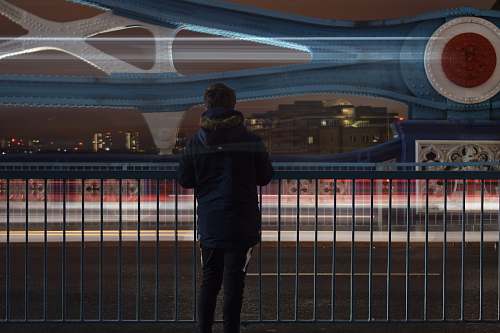 human man standing in front of steel railings people