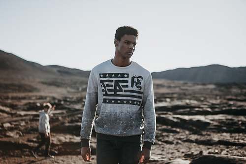 people man standing on field at daytime human