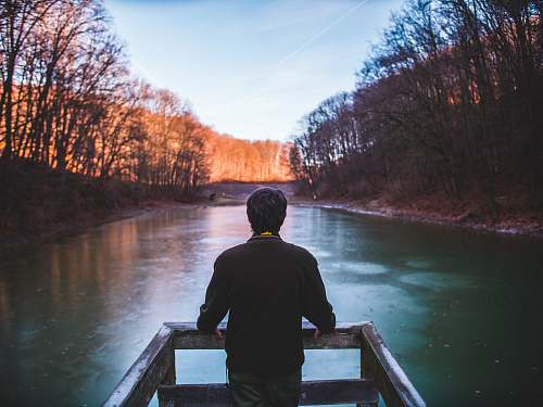 people man standing on lake dock human