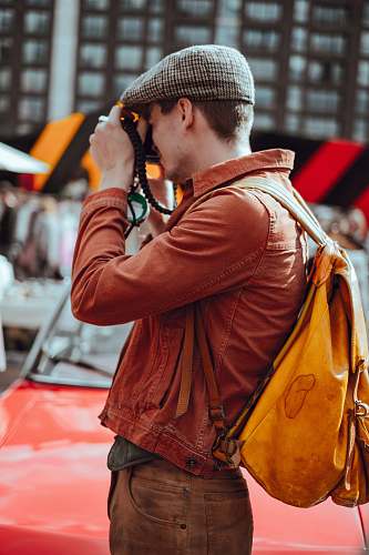 people man taking photo near building human
