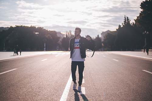 human man walking on street people