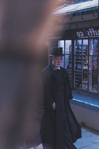 human man walking outside the store people