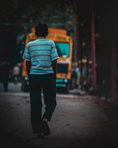 human man walking towards the truck people