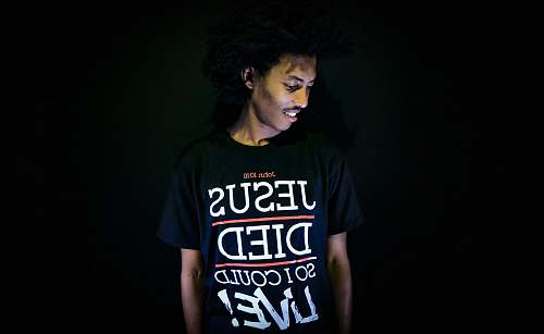 human man wearing black crew-neck t-shirt people