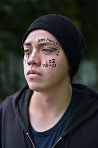 human man wearing black hoodie people