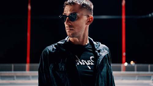 people man wearing black jacket and sunglasses close-up photo human