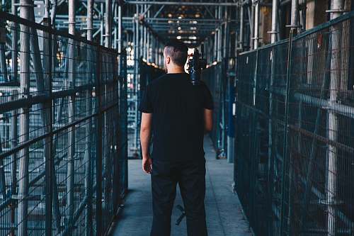 human man wearing black shirt people