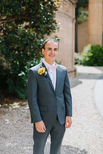 people man wearing gray suit suit