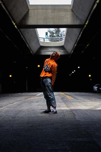 people man wearing orange hoodie human