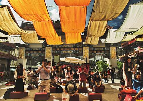 people people kneeling on red cushion human
