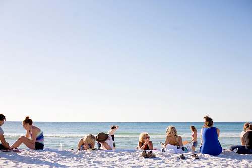people people on white sands by the beach human