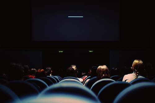 people people sitting on chair theater