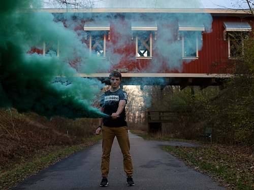 human person surrounded by green smoke people