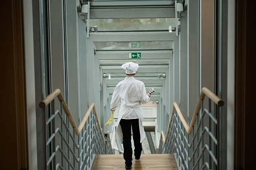 people person wearing white apron walkin on stairs human