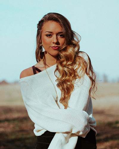 human portrait of woman in white long-sleeved top people