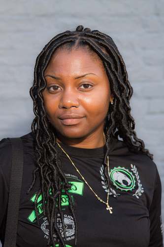 human portrait photography of woman wearing black shirt and gold necklace people