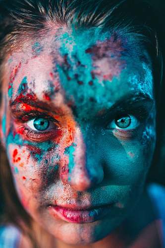 human portrait photography of woman with face paint people