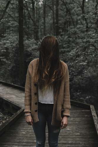 human selective focus photo of woman standing on dock people