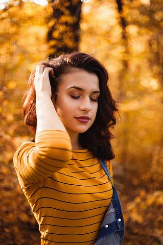 human selective focus photography of woman closed her eye people